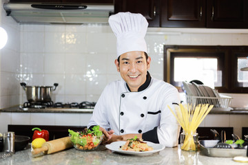 Asian Chef cooking in kitchen restaurant