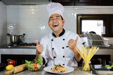 Asian Chef cooking in kitchen restaurant