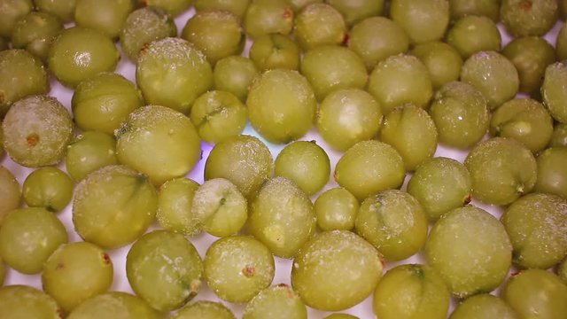 Gooseberry gooseberries footage video on slow motion rotating rolling plate