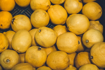 lemons texture background selling fruit at the market tinted photo