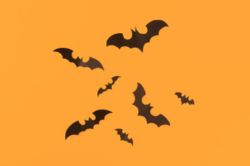 Halloween paper decorations on orange background. Halloween concept. Flat lay, top view, copy space - Image