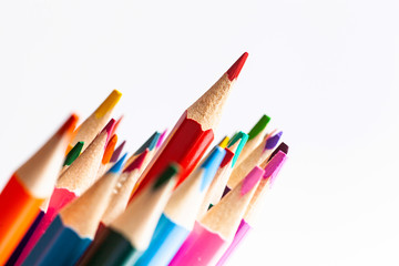 A bunch of colored pencils in the center of the frame. Close-up.