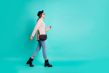 Full length body size view of her she nice-looking attractive lovely charming pretty cute fashionable girl walking isolated over bright vivid shine vibrant color turquoise green background