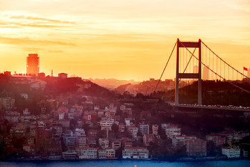 View of the city of Istanbul and the bridge over the Bosphorus at sunset.