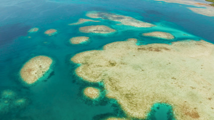 Fototapeta na wymiar Seascape: Atoll and coral reef with blue water, copy space for text. from above. Bucas grande, Philippines. Summer and travel vacation concept.