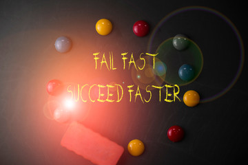 Word writing text Fail Fast Succeed Faster. Business photo showcasing dont give up keep working on it to achieve Round Flat shape stones with one eraser stick to old chalk black board