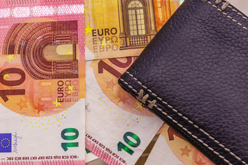 Black wallet with euro currency banknotes. Copy space for text. Money savings, personal finances