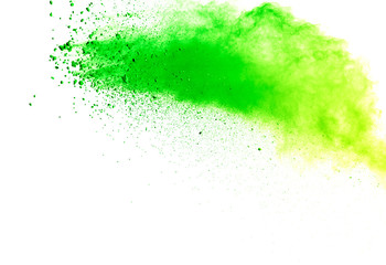 Green powder explosion on white background.