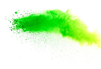 Green powder explosion on white background.