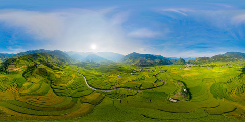360 panorama by 180 degrees angle seamless panorama view of paddy rice terraces, green agricultural fields in rural area of Mu Cang Chai, mountain hills valley in Vietnam. Nature landscape background.