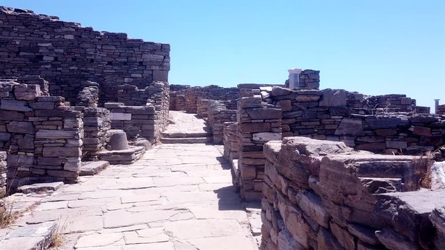 Pan left shot of old ruins on Delos island Archaeological Site, Greece