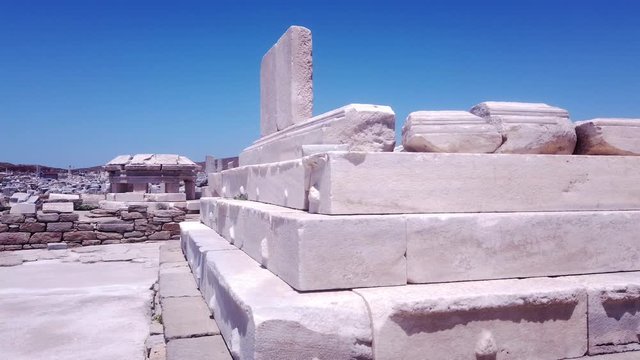 Tracking shot of stone blocks from Delos Archaeological Site, Greece