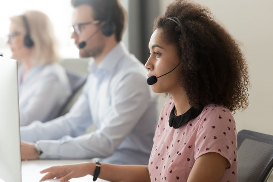Side view african call center employee gives assistance distantly
