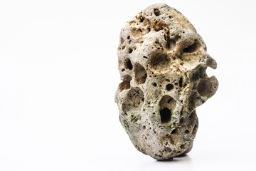 Image of a rocky object on a white background with free space.