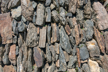 Natural stone abstract background wall made by ancient Inca of Peru in South America. Background with copy space