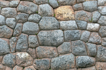 Natural stone abstract background wall made by ancient Inca of Peru in South America. Background with copy space