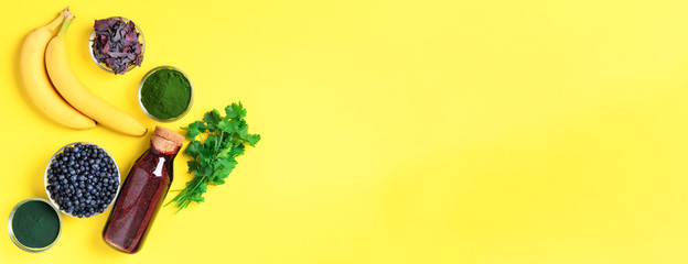 Banner of ingredients for heavy metals detox smoothie. Bilberry, barley grass, spirulina, orange...