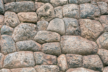 Natural stone abstract background wall made by ancient Inca of Peru in South America. Background with copy space