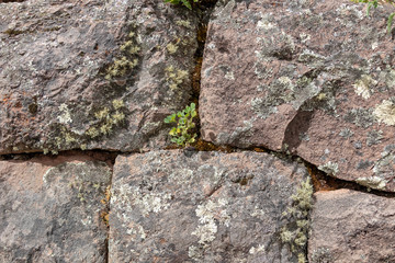 Natural stone abstract background wall made by ancient Inca of Peru in South America. Background with copy space