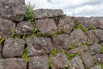 Natural stone abstract background wall made by ancient Inca of Peru in South America. Background with copy space