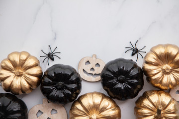 Halloween luxury gold and black pumpkin flat lay background composition