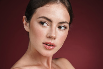Image of caucasian shirtless woman looking at copyspace