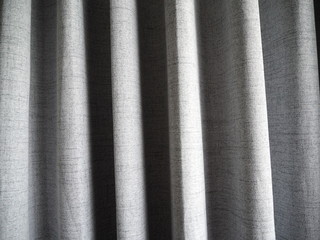 grey curtain background or grey drape background. curtain fabric wave background texture.