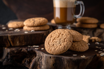 Biscuit with berry or fruit filling. Crispy and crumbly delicious cookies with natural ingredients: flour, nuts, seeds, pieces of chocolate, cocoa, fruit jams.   Stylish still life for poster.