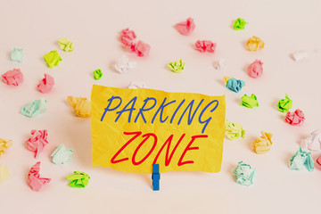 Word writing text Parking Zone. Business photo showcasing a space where an automobile can be parked Allowed to parked Colored crumpled papers empty reminder white floor background clothespin