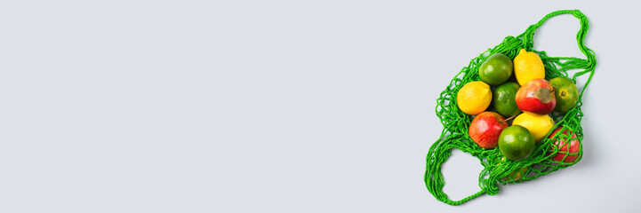 Mesh bag with fruits, vegetables. Zero waste, plastic free concept