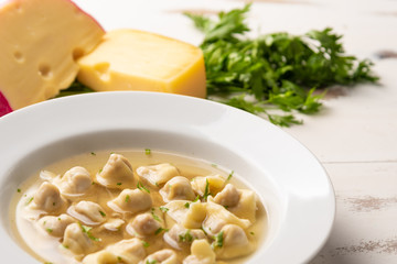 Fresh capeletti soup; Capeletti in brodo - Italian cuisine, soft light, copy space
