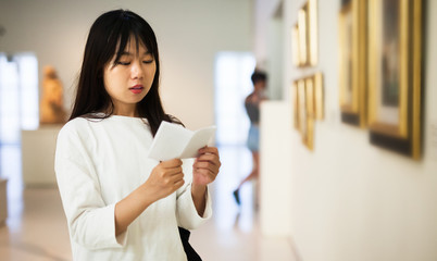Chinese female visitor in museum