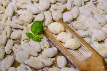 Cook homemade gnocchi on the table, Italian tradition