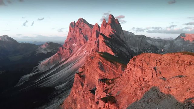 Stunning mountain peaks with alpenglow at sunset