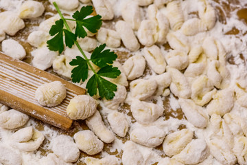 Cook homemade gnocchi on the table, Italian tradition