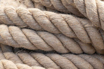 Nautical rope in close-up. Old frayed boat rope. Nautical background. 