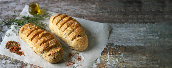Homemade Italian bread with herbs and spices. Selective focus. Macro.
