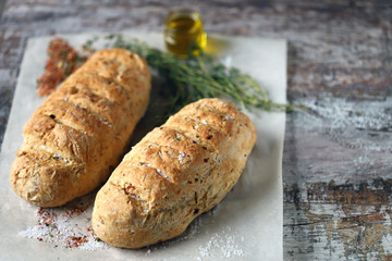 Homemade Italian bread with herbs and spices. Selective focus. Macro.