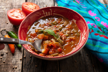 Mexican style lentil soup with tomato and nopal cactus