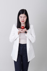 Fototapeta premium Asian woman hand holding a christmas red ball