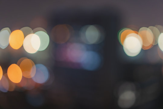 Abstract Bokeh Blurred Color Light in the city night. Glitter Background. Defogused.
