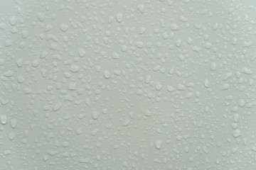 Drops of water on the surface of the white Pew.