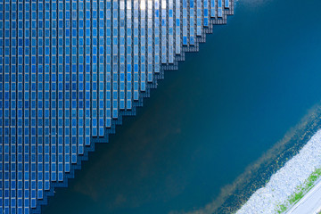 Solar Photovoltaic of solar farm aerial view, solar plant rows array of on the water mount system...