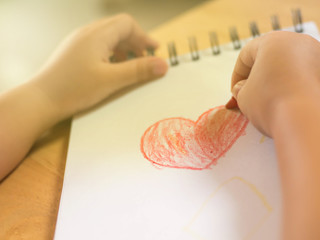 hand of kid drawing heart shape.Concept of love.