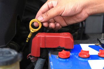 Naklejka premium Oil engine checker with hand.