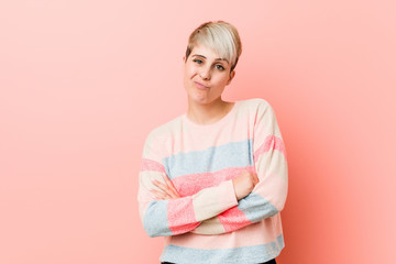 Young natural curvy woman unhappy looking in camera with sarcastic expression.