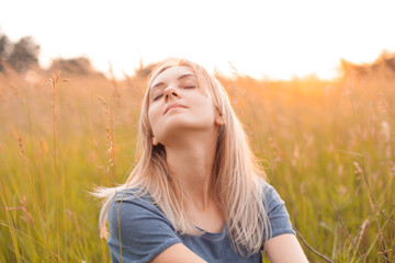 Obraz premium Portrait of a woman with beautiful blonde hair. Eyes closed