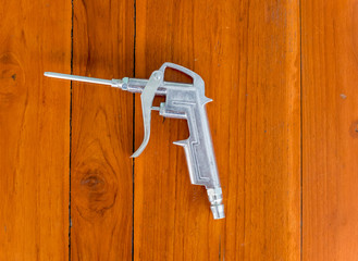 Air blow Gun, on wood table. close up photo