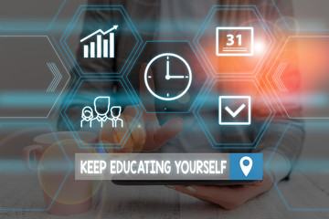 Fototapeta premium Word writing text Keep Educating Yourself. Business photo showcasing dont stop studying Improve yourself using Courses Woman wear formal work suit presenting presentation using smart device