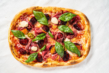 creative pizza with beef and cherries